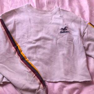 Woman’s white short cut Hollister sweatshirt. Size Medium